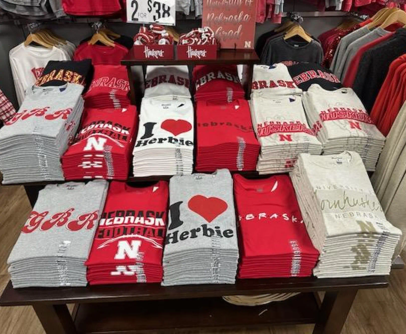 Nebraska shirts folded and arranged on a retail display